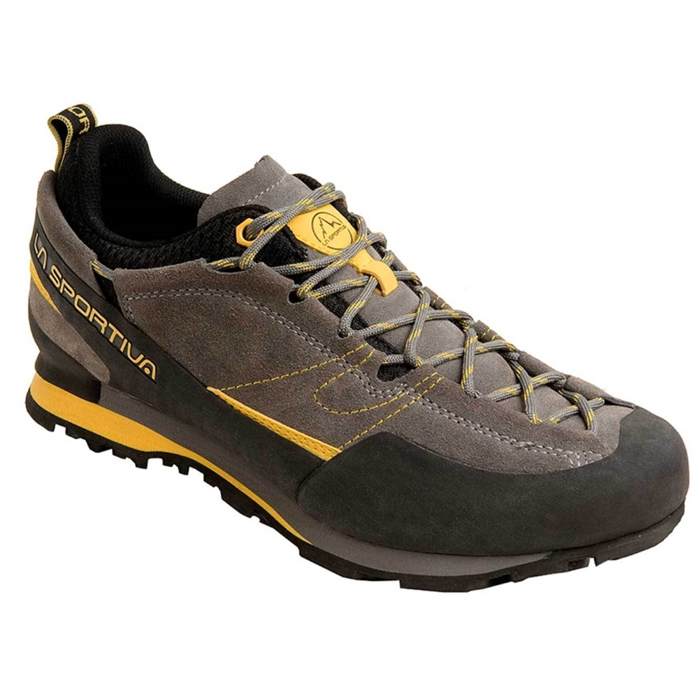Pánské trailové boty La Sportiva Boulder X  Grey/Yellow  44.


	inovativní šněrovací systém protažený do špičky
	podrážka tlumící nárazy
	skvělá trakce
	ochranná pryžová špička
	velmi komfortní
	gumová obsázka
	hmotnost: 900 g (pár vel.
	svršek: velurová kůže
	podšívka: mesh
	mezipodešev: EVA
	podešev: Vibram® s IBS
	tlumící systém: Impact Brake System®